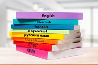 A stack of books, each one of them in a different language.