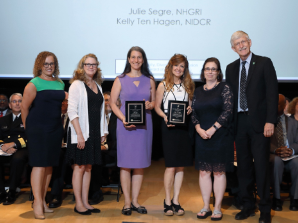 From left, Debra Chew, Esq., Anna Nicholson, MSHS, Julia Segre Ph.D., Kelly Ten Hagen, Ph.D. , Ellen M. Rolfes, M.A., and Francis Collins, M.D., Ph.D.