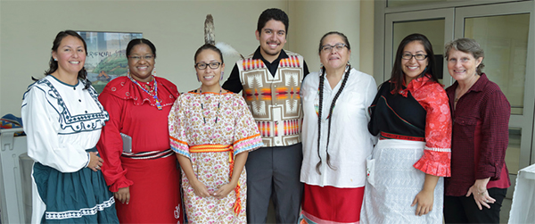 Rita Devine and some colleagues pose for a group photo.