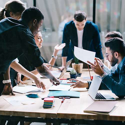 Diverse group members conducting a meeting at a table