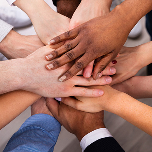 Image of hands of various races overlapping