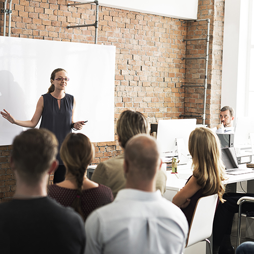 A female instructor conducting a class